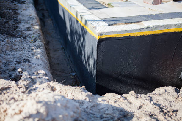 Professional Basement Waterproofing technician working in Westport, WA